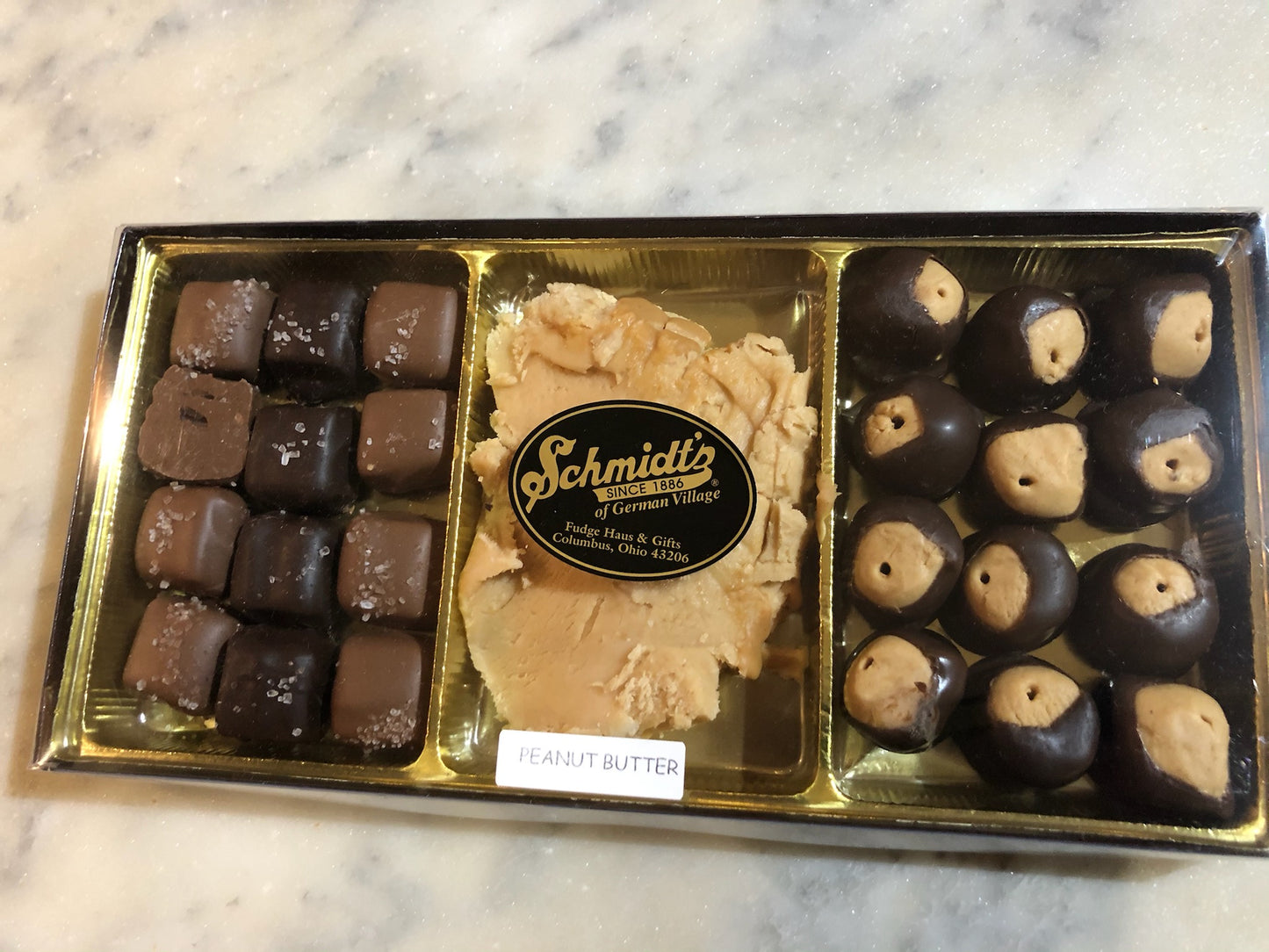 A box set of sea salt caramels, peanut butter fudge, and 15 chocolate peanut butter buckeyes