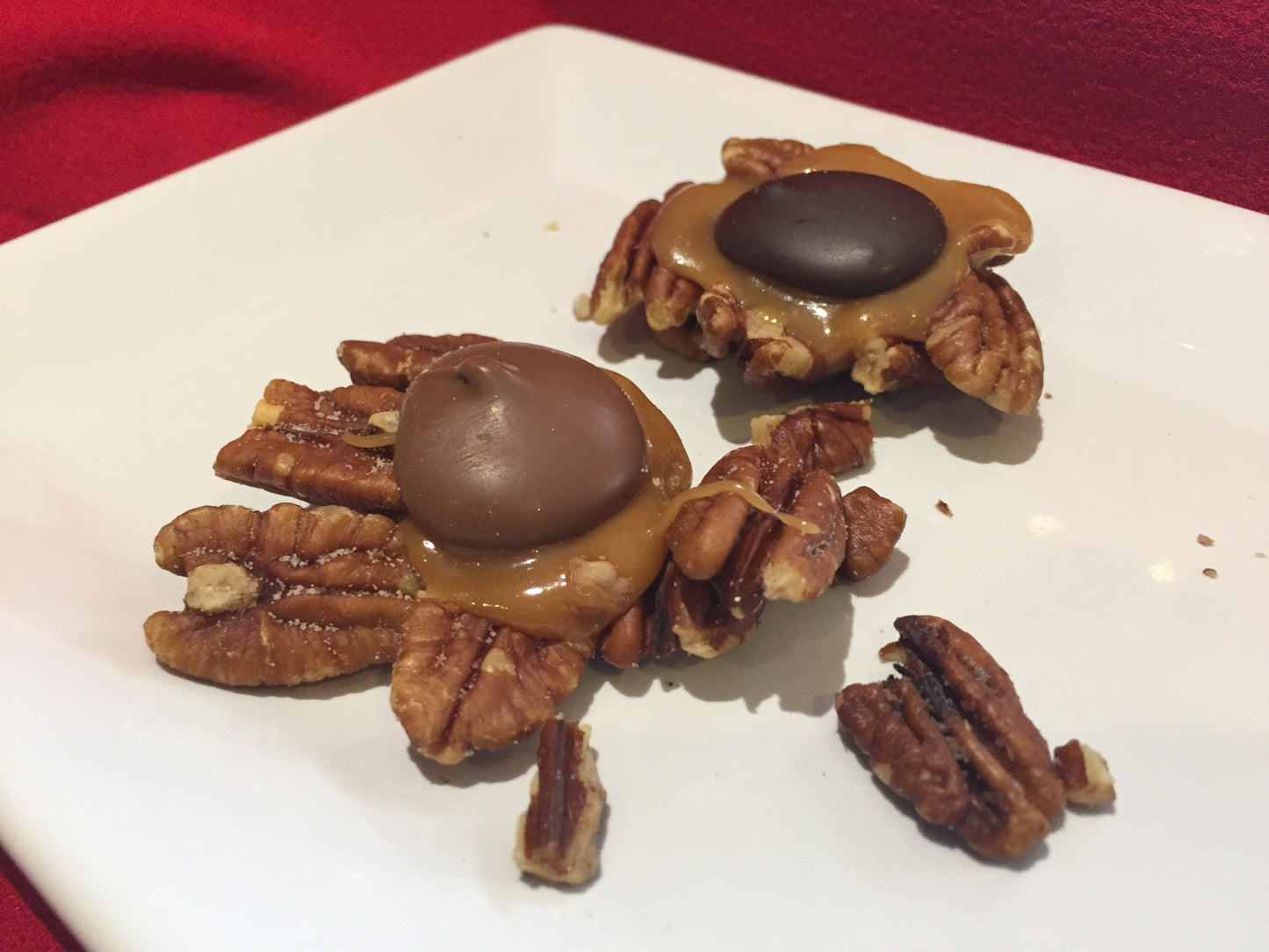 salty pecans topped with caramel and Belgian chocolate